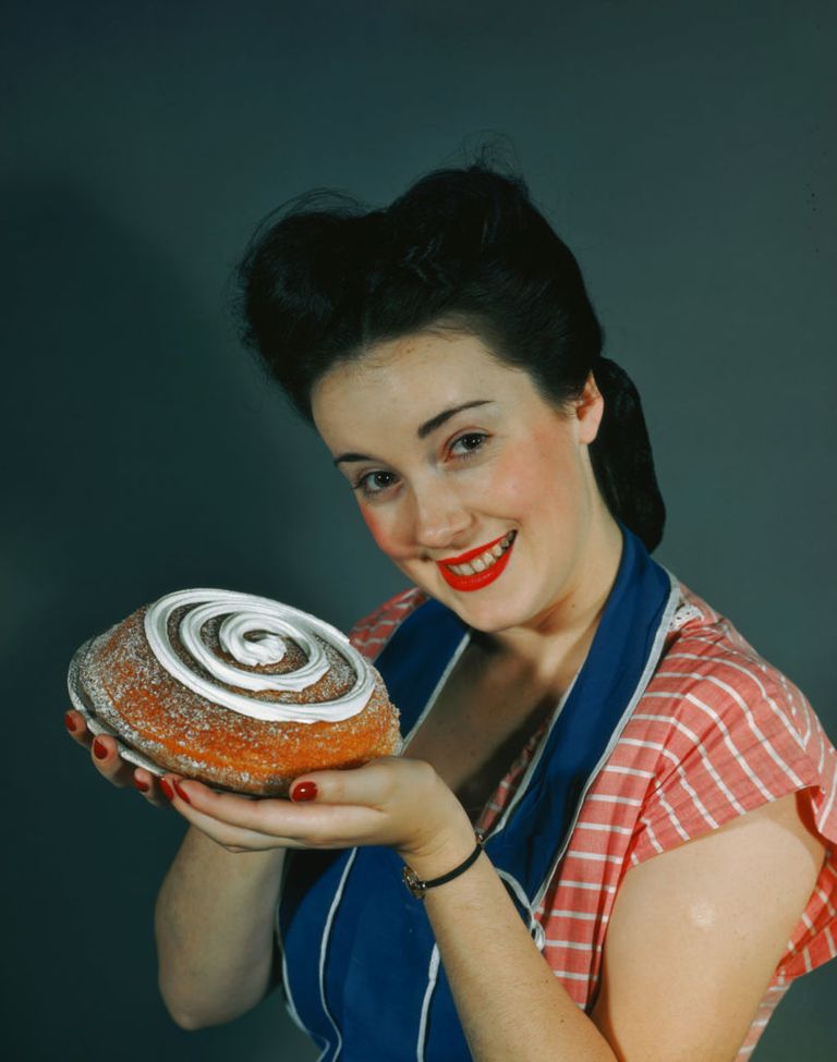 https://www.gettyimages.com/detail/news-photo/housewife-proffers-a-cake-with-a-spiral-of-cream-on-top-news-photo/56730780?adppopup=true