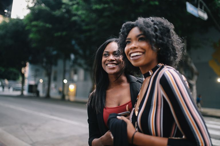 https://www.gettyimages.com/detail/photo/two-young-female-friends-walking-in-downtown-los-royalty-free-image/1134367657?phrase=talking+evening