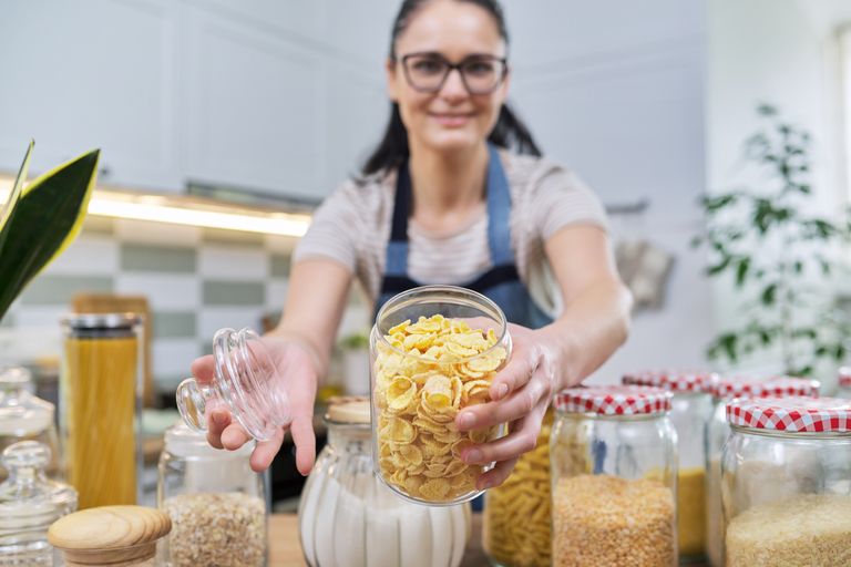 https://www.gettyimages.com/detail/photo/woman-showing-a-jar-of-corn-flakes-food-storage-in-royalty-free-image/1370571559?phrase=grains+pantry&adppopup=true