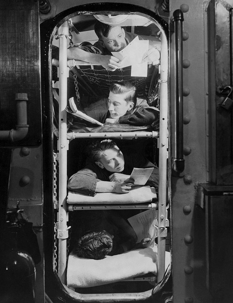 https://www.gettyimages.com/detail/news-photo/four-submarine-crewmen-relax-in-their-bunks-reading-news-photo/613496612?adppopup=true