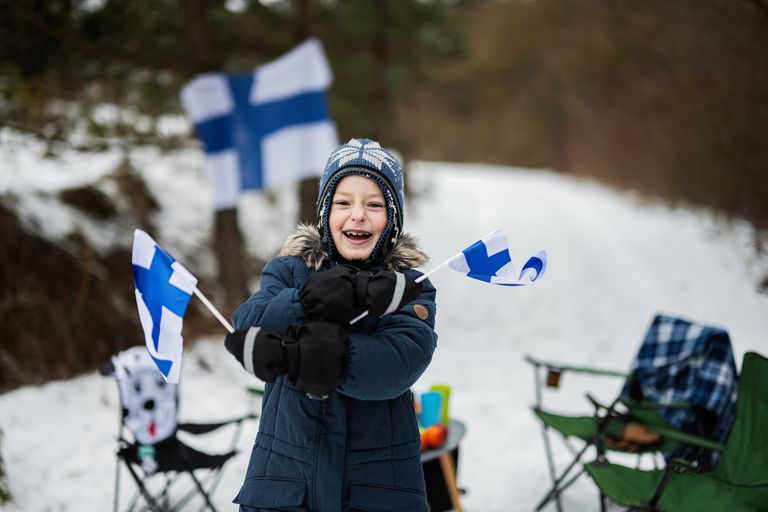https://www.gettyimages.co.uk/detail/photo/finnish-boy-with-finland-flags-on-a-nice-winter-day-royalty-free-image/1470161437