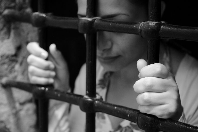https://www.gettyimages.com/detail/photo/young-woman-behind-prison-bars-royalty-free-image/168265215?phrase=woman+writing+jail+vintage