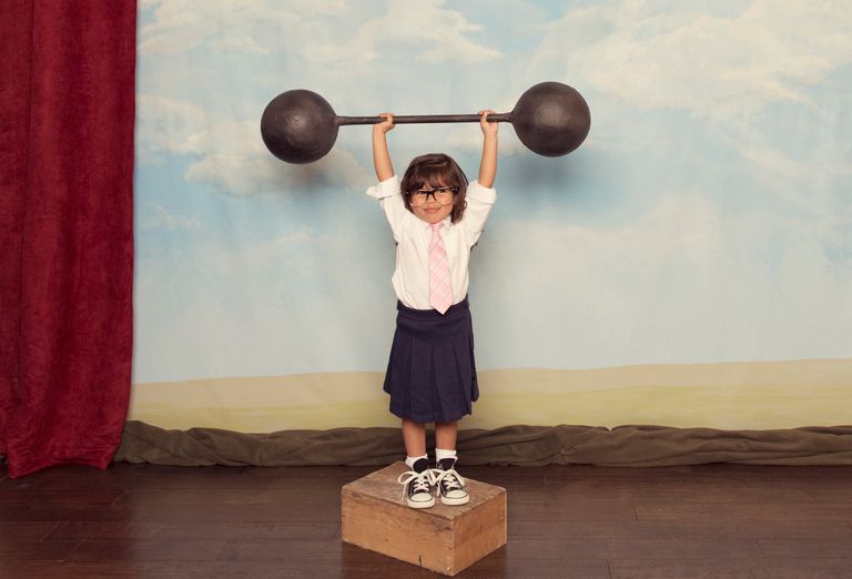 https://www.gettyimages.co.uk/detail/photo/young-business-girl-lifts-barbell-on-stage-royalty-free-image/451783745