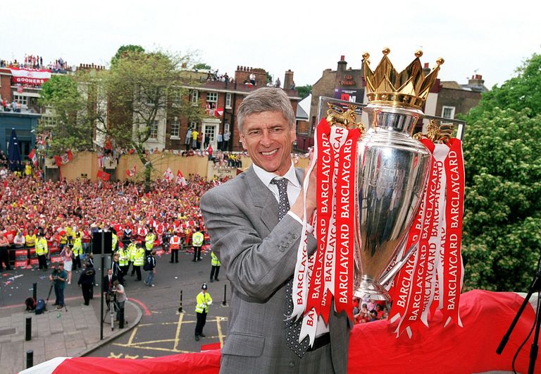 https://www.gettyimages.co.uk/detail/news-photo/arsenal-manager-arsene-wenger-holds-the-premier-league-news-photo/461393871