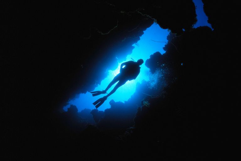 https://www.gettyimages.co.uk/detail/photo/scuba-diver-descends-through-chimney-in-coral-reef-royalty-free-image/200027358-001?phrase=Scuba+diver+descends+through+chimney+in+coral+reef