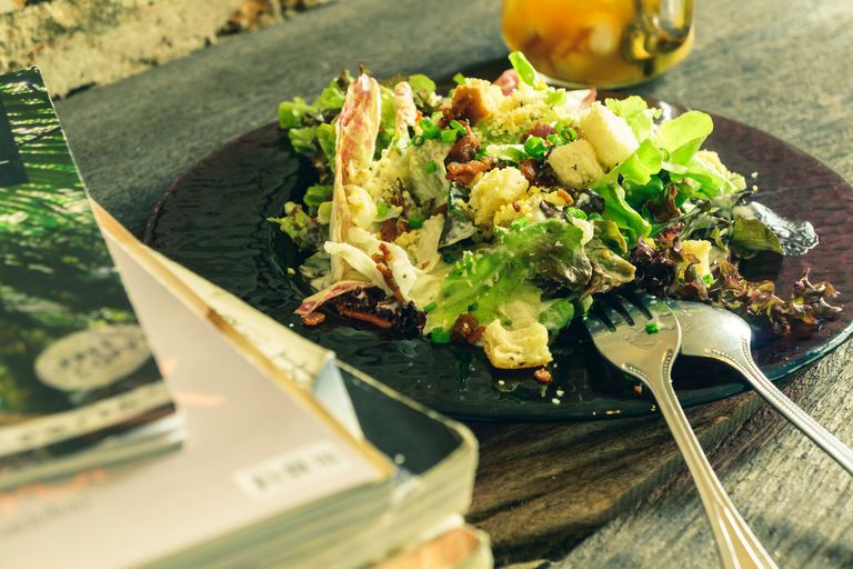 https://www.gettyimages.com/detail/photo/caesar-salad-on-grunge-wooden-table-and-brick-wall-royalty-free-image/480423676?phrase=Caesar+salad+vintage&adppopup=true