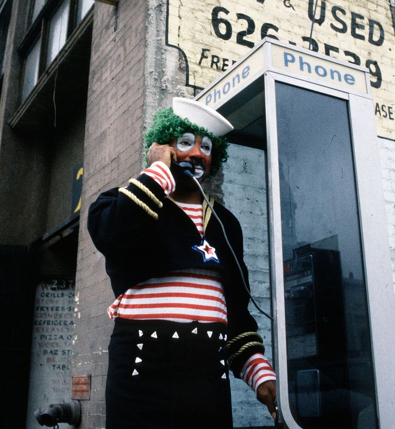 https://www.gettyimages.co.uk/detail/news-photo/an-actor-dressed-as-a-clown-talks-on-a-pay-telephone-during-news-photo/1473897215?adppopup=true