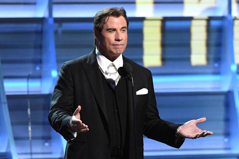 https://www.gettyimages.com/detail/news-photo/actor-john-travolta-speaks-onstage-during-the-59th-grammy-news-photo/634984306