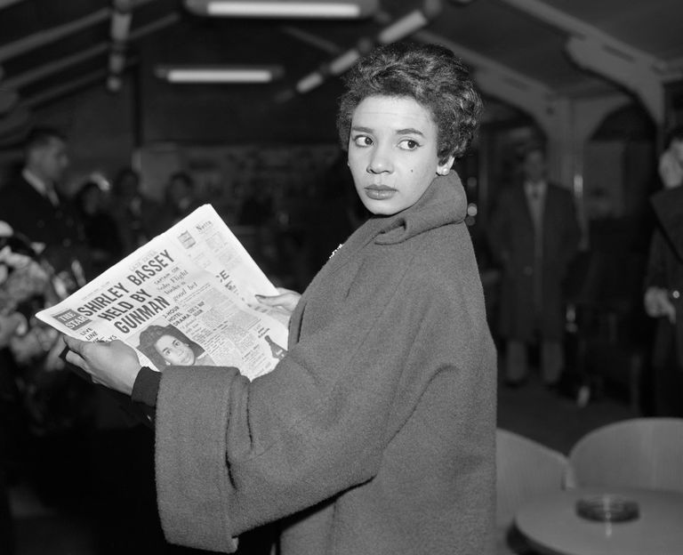 https://www.gettyimages.co.uk/detail/news-photo/singer-shirley-bassey-seen-reading-a-newspaper-story-about-news-photo/809684574