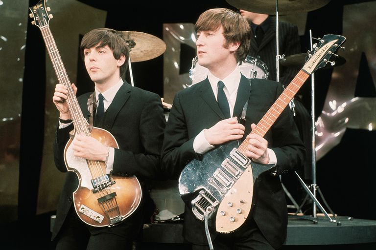 https://www.gettyimages.com/detail/news-photo/paul-mccartney-and-john-lennon-hold-their-guitars-while-on-news-photo/515097396