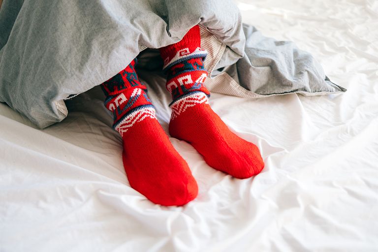https://www.gettyimages.co.uk/detail/photo/feet-wearing-red-knitted-socks-under-a-blanket-royalty-free-image/1455477438?phrase=sleeping+socks+vintage