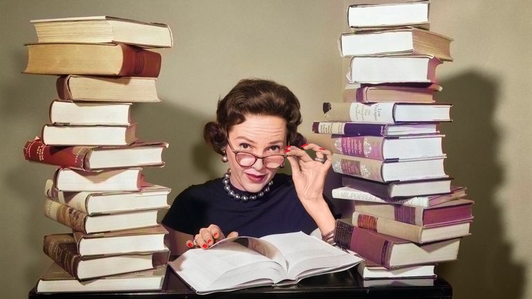 https://www.gettyimages.co.uk/detail/news-photo/1950s-woman-librarian-sitting-between-stacks-of-books-news-photo/1392975471