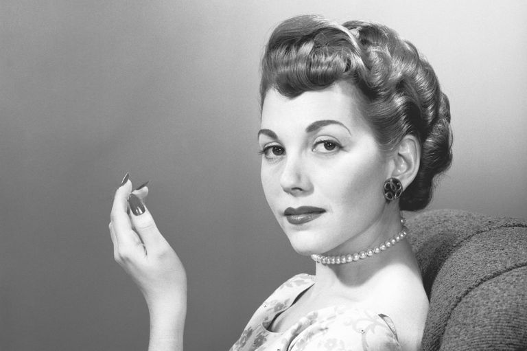 https://www.gettyimages.co.uk/detail/photo/elegant-woman-smoking-cigarette-in-studio-portrait-royalty-free-image/72418031