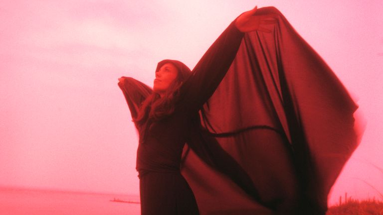 https://www.gettyimages.co.uk/detail/news-photo/1960s-1970s-woman-in-eerie-red-light-standing-on-sand-dune-news-photo/1298273163