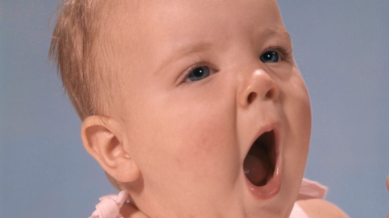 https://www.gettyimages.co.uk/detail/photo/portrait-of-baby-yawning-wearing-pink-dress-royalty-free-image/81773100?phrase=Portrait+Of+Baby+Yawning+Wearing+Pink+Dress