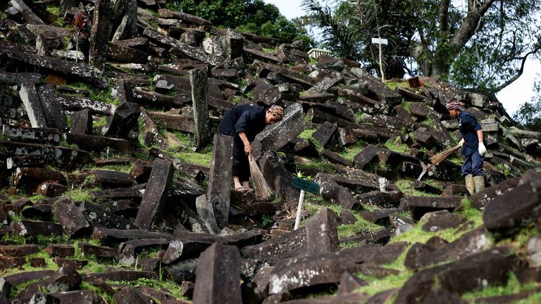 https://www.gettyimages.com/detail/news-photo/man-sweeps-the-gunung-padang-megalithic-site-in-west-java-news-photo/458781986?adppopup=true