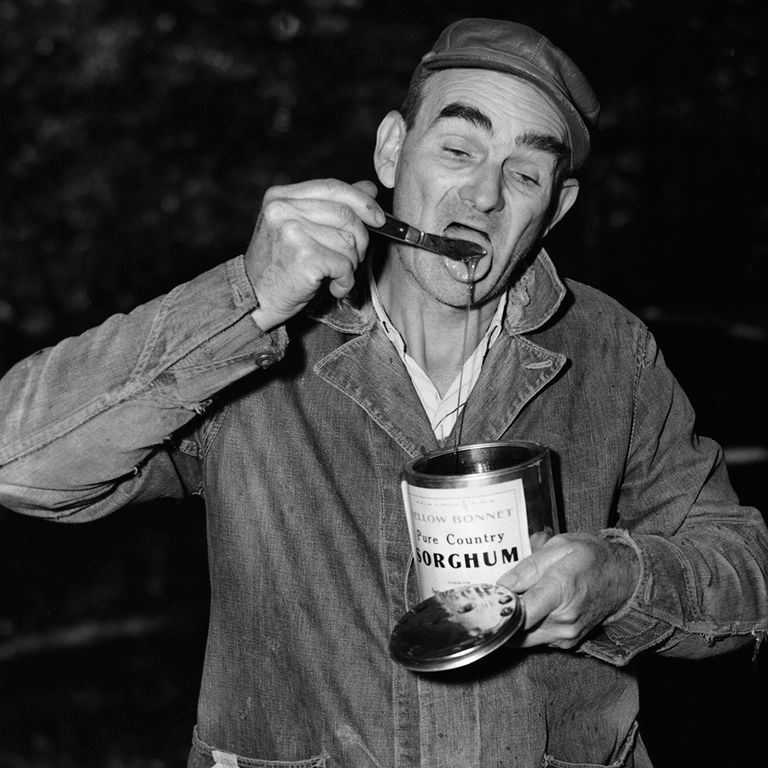 https://www.gettyimages.co.uk/detail/news-photo/an-ozark-man-uses-a-knife-to-taste-syrup-from-a-tin-of-news-photo/1552477090?adppopup=true