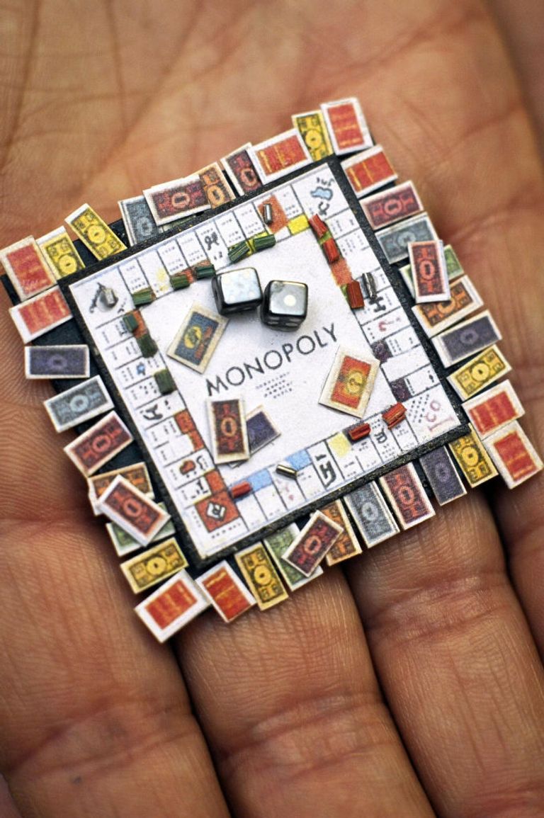 https://www.gettyimages.co.uk/detail/news-photo/miniature-monopoly-board-complete-with-houses-cards-and-news-photo/809645618?adppopup=true