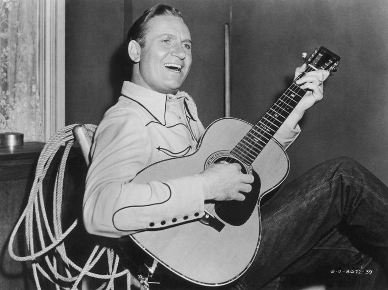 https://www.gettyimages.co.uk/detail/news-photo/country-and-western-singer-gene-autry-pictured-sitting-in-a-news-photo/103661123