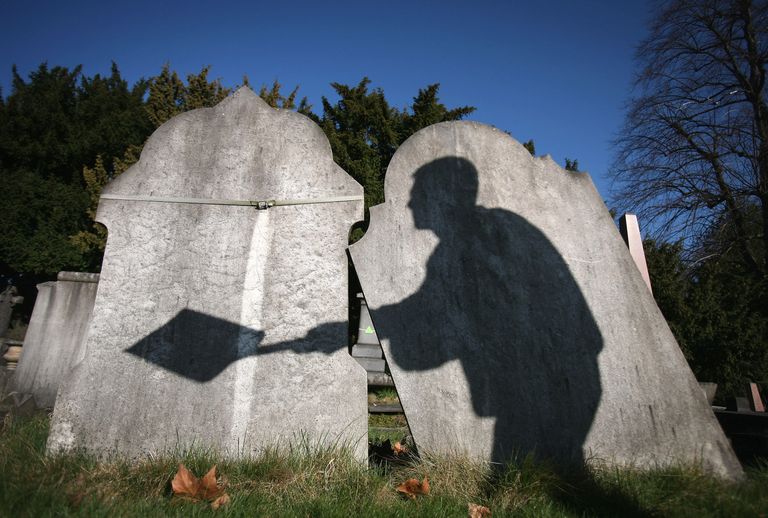 https://www.gettyimages.co.uk/detail/news-photo/the-shadow-of-a-cemetery-worker-is-cast-on-reclaimed-news-photo/85208336