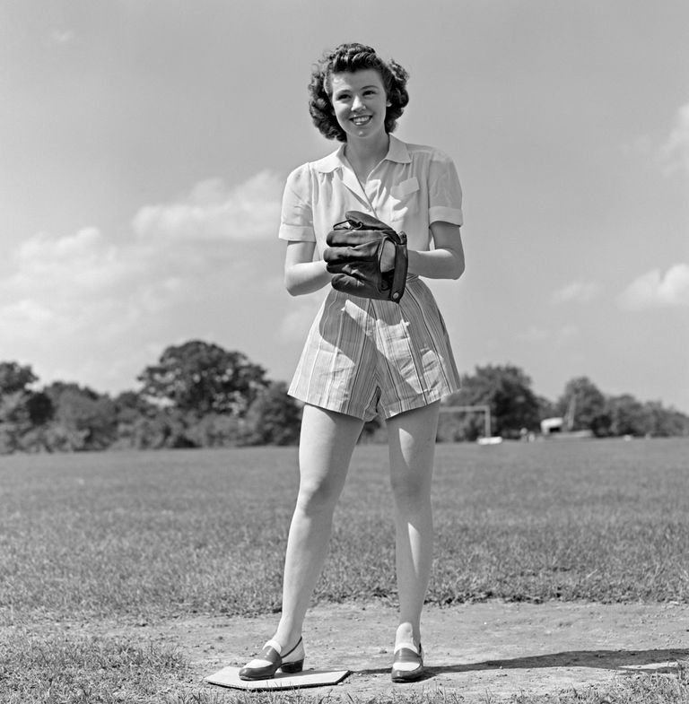 https://www.gettyimages.co.uk/detail/news-photo/1940s-smiling-teen-girl-wearing-shorts-standing-on-pitchers-news-photo/563939385?adppopup=true