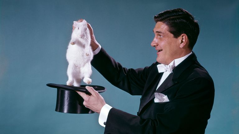 https://www.gettyimages.co.uk/detail/news-photo/1960s-magician-wearing-black-tuxedo-smiling-pulling-white-news-photo/563941523