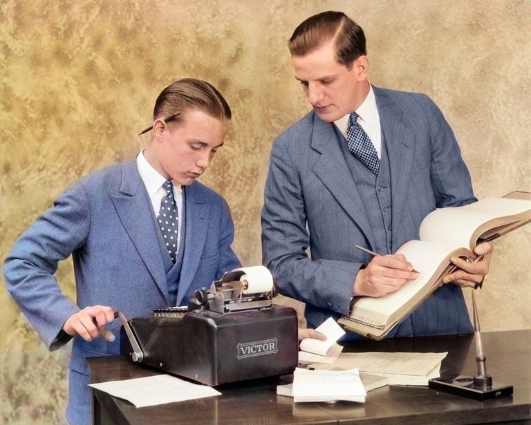 https://www.gettyimages.com/detail/news-photo/1920s-bookkeeper-and-young-assistant-in-office-using-ledger-news-photo/1333960015