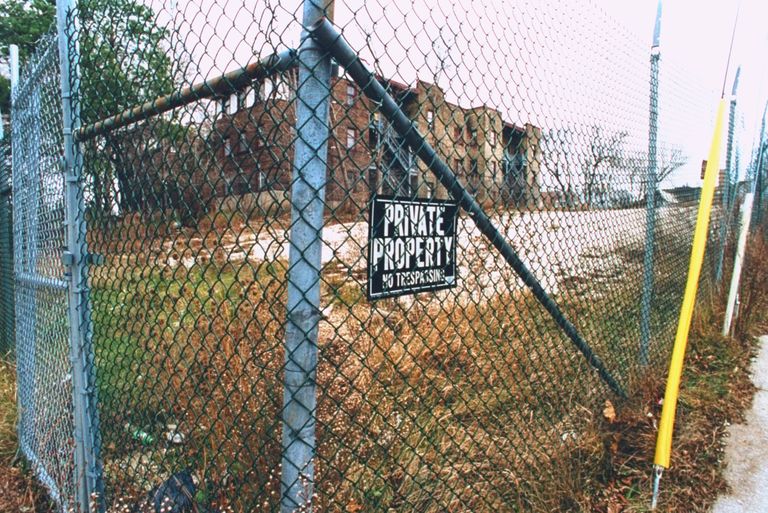 https://www.gettyimages.com/detail/news-photo/fence-bordered-vacant-lot-sporting-a-private-property-no-news-photo/50477057