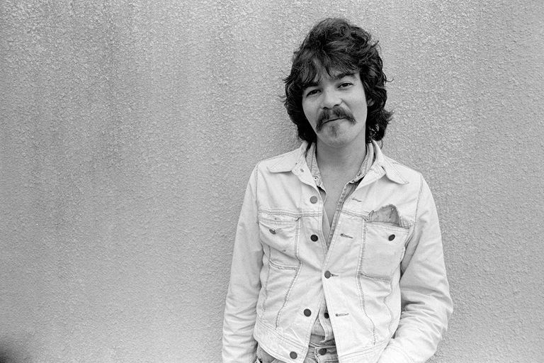 https://www.gettyimages.com/detail/news-photo/singer-songwriter-john-prine-hangs-out-on-campus-before-news-photo/117261108