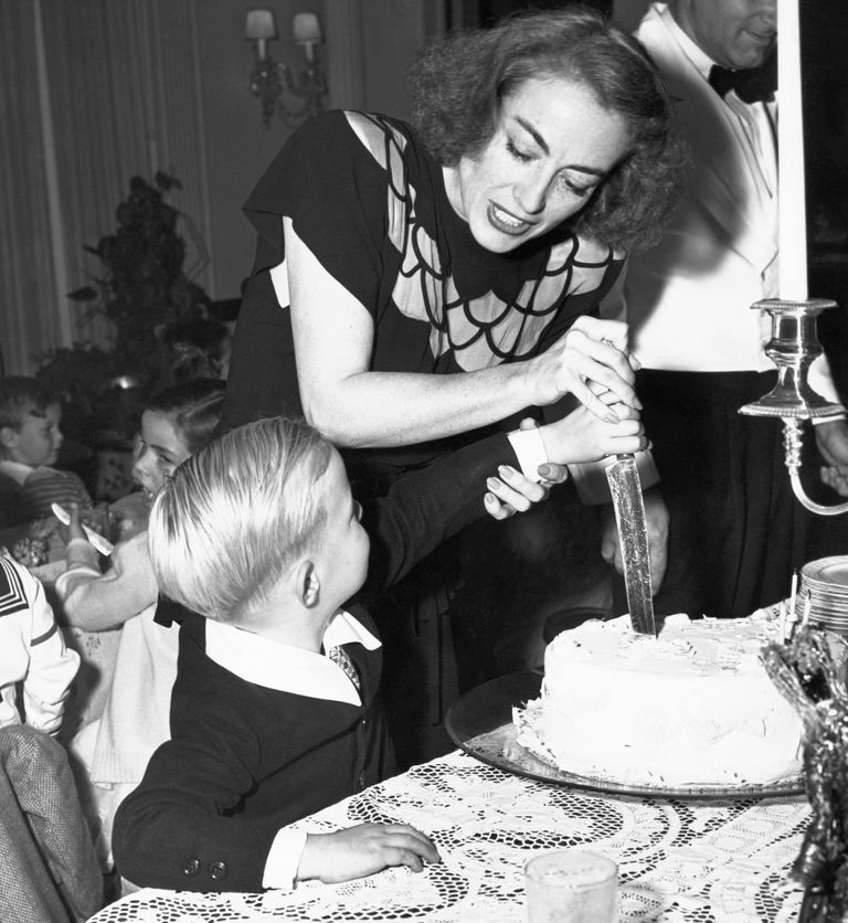 https://www.gettyimages.com/detail/news-photo/joan-crawford-helps-her-adopted-son-christopher-cut-his-news-photo/517332182