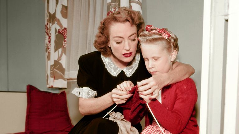 https://www.gettyimages.com/detail/news-photo/joan-crawford-pictured-teaching-daughter-knitting-at-home-news-photo/1435789667