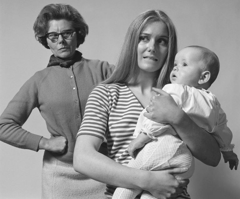 https://www.gettyimages.co.uk/detail/news-photo/an-anxious-young-mother-cowers-under-the-disapproving-gaze-news-photo/73921929