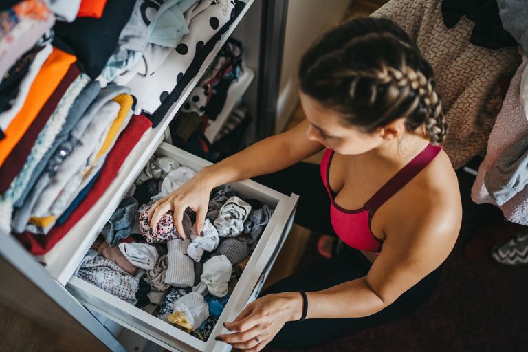 https://www.gettyimages.co.uk/detail/photo/woman-sorting-out-wardrobe-royalty-free-image/1241376358?phrase=underwear+drawer