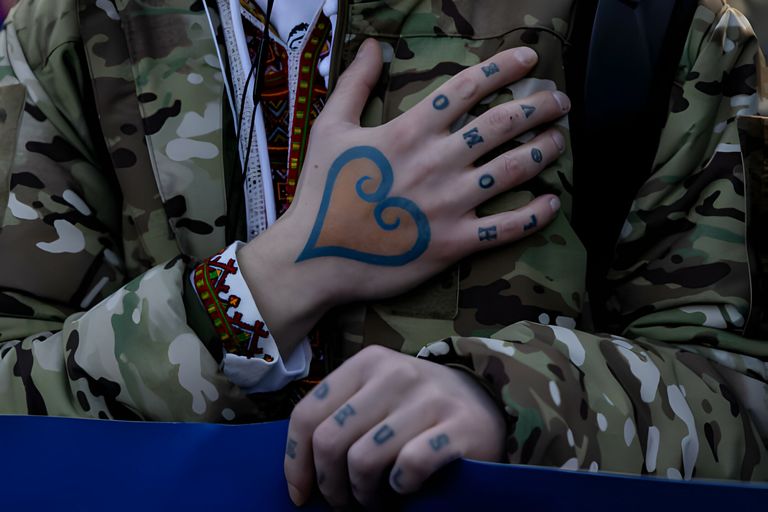 https://www.gettyimages.co.uk/detail/news-photo/man-displays-a-heart-shaped-tattoo-coloured-in-ukrainian-news-photo/1370149447
