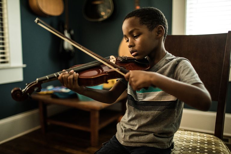 https://www.gettyimages.co.uk/detail/photo/young-boy-practicing-violin-royalty-free-image/1182087870
