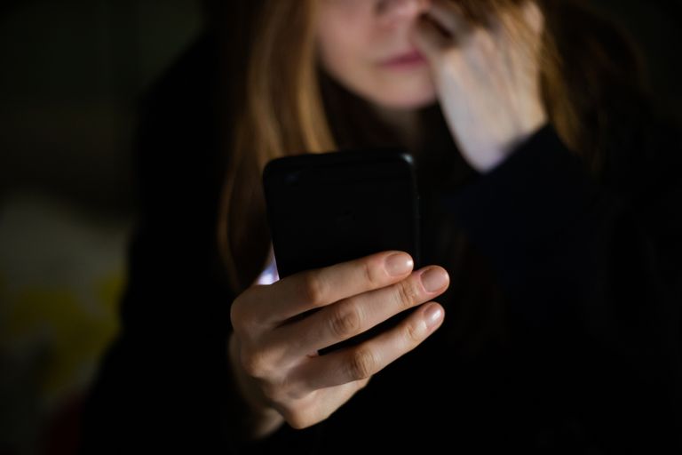 https://www.gettyimages.co.uk/detail/photo/woman-using-mobile-phone-at-night-text-online-royalty-free-image/1221248769
