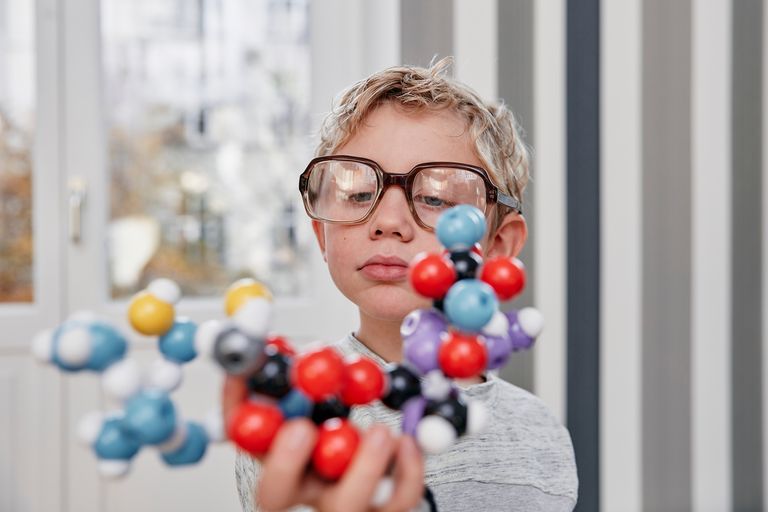 https://www.gettyimages.co.uk/detail/photo/boy-wearing-oversized-glasses-looking-at-molecular-royalty-free-image/694034267