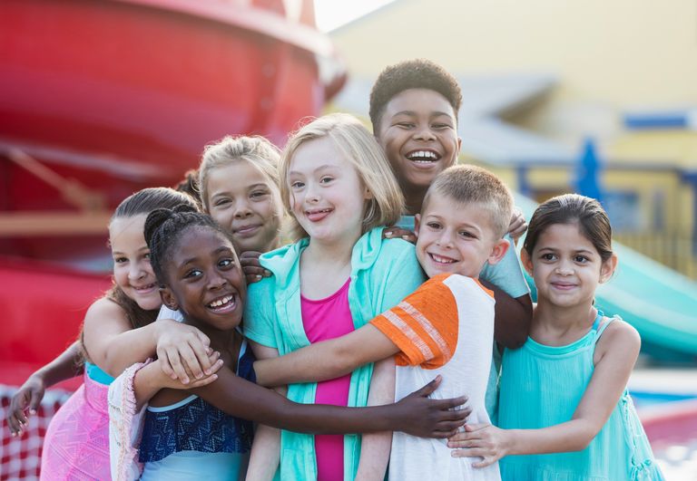 https://www.gettyimages.co.uk/detail/photo/girl-with-down-syndrome-friends-at-water-park-royalty-free-image/1297509689