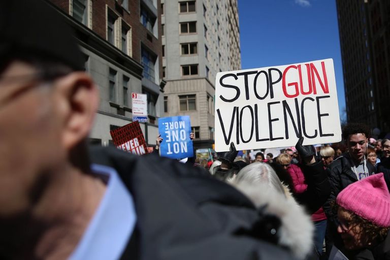 https://www.gettyimages.co.uk/detail/news-photo/protester-holds-a-banner-reading-stop-gun-violence-during-news-photo/937403376