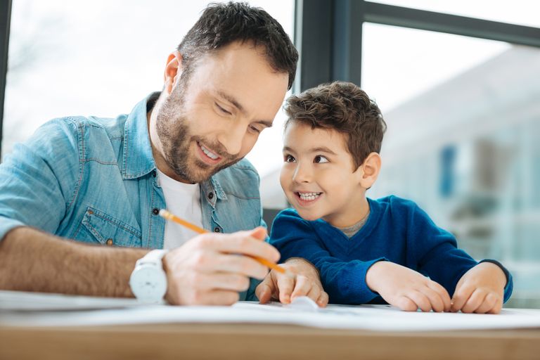 https://www.gettyimages.co.uk/detail/photo/cheerful-kid-smiling-at-father-drawing-a-blueprint-royalty-free-image/909070920