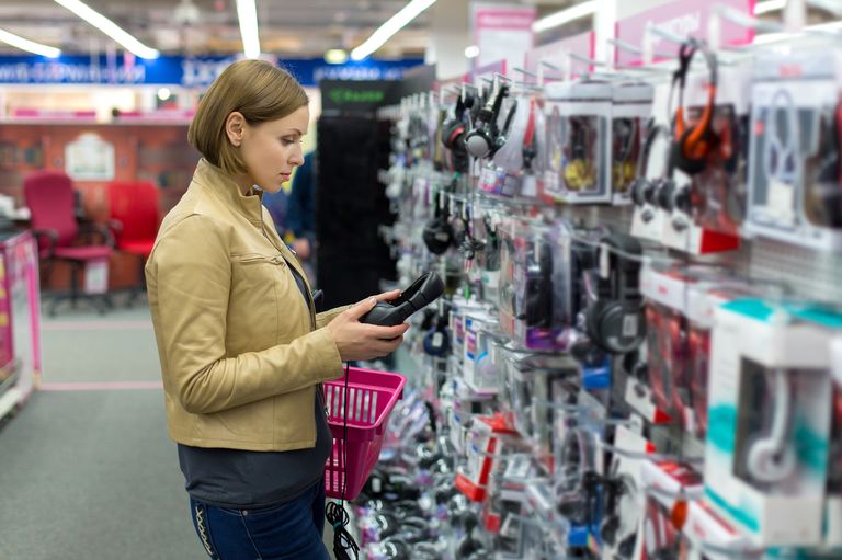 https://www.gettyimages.co.uk/detail/photo/woman-chooses-headphones-store-royalty-free-image/538780799