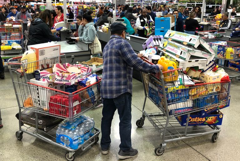 https://www.gettyimages.co.uk/detail/news-photo/costco-customer-stands-by-his-two-shopping-carts-at-a-news-photo/1212223282