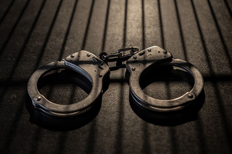 https://www.gettyimages.com/detail/photo/handcuffs-royalty-free-image/1905024012?phrase=arrest