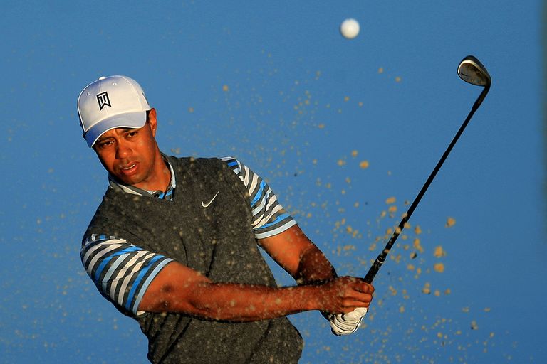 https://www.gettyimages.com/detail/news-photo/tiger-woods-hits-a-bunker-shot-during-a-practice-round-news-photo/85014063
