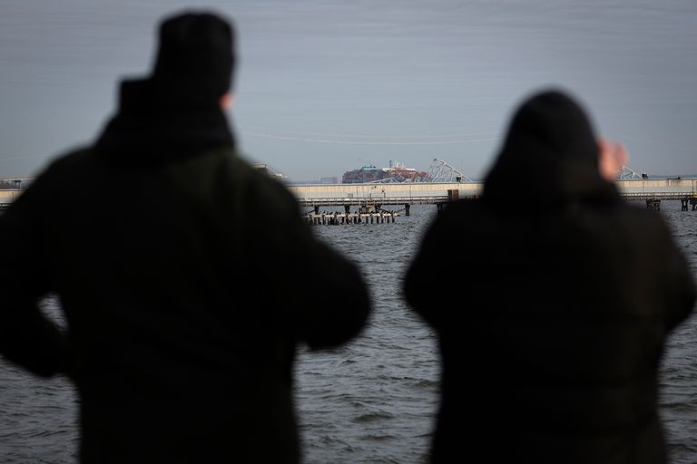 https://www.gettyimages.com/detail/news-photo/local-residents-watch-as-a-cargo-ship-is-shown-after-news-photo/2114606353