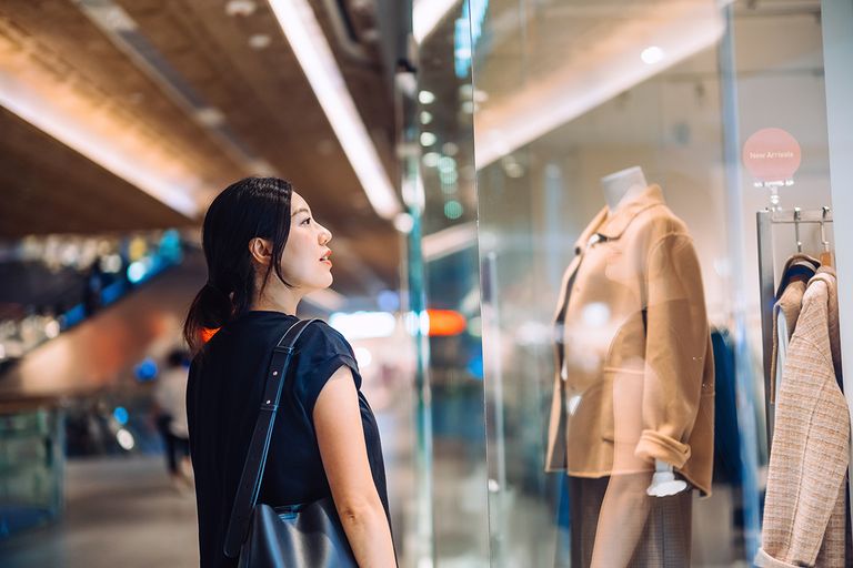 https://www.gettyimages.com/detail/photo/young-asian-woman-standing-outside-a-boutique-royalty-free-image/1442106841?phrase=thinking+shopping